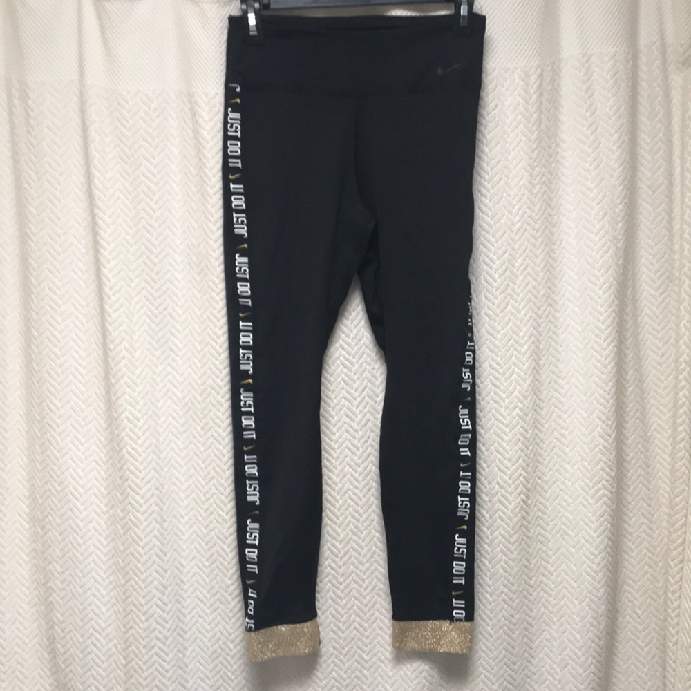 Nike black with gold trim at the bottom